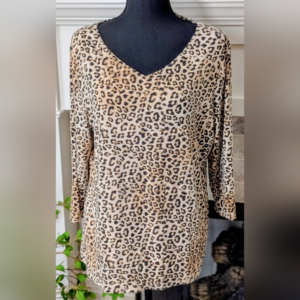 Chico'scream background with black and brown animal print V-neck 3/4 Sleeve Top.